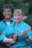 Vince and Charlene standing with ukuleles